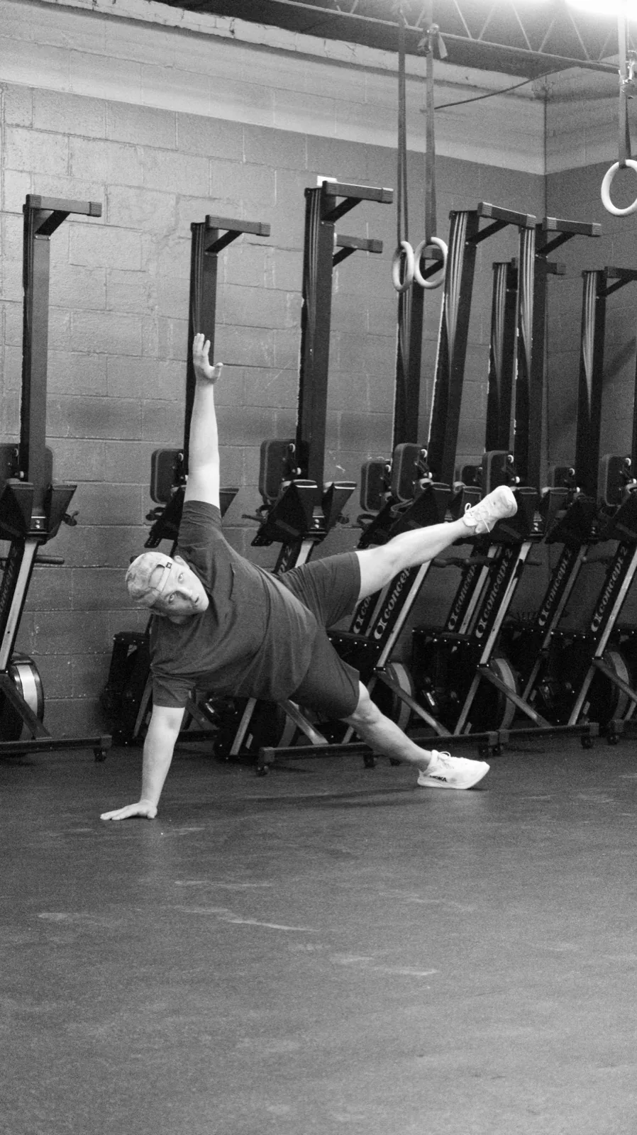 Vickery Athletics member holding a side plank during a coached class in East Dallas